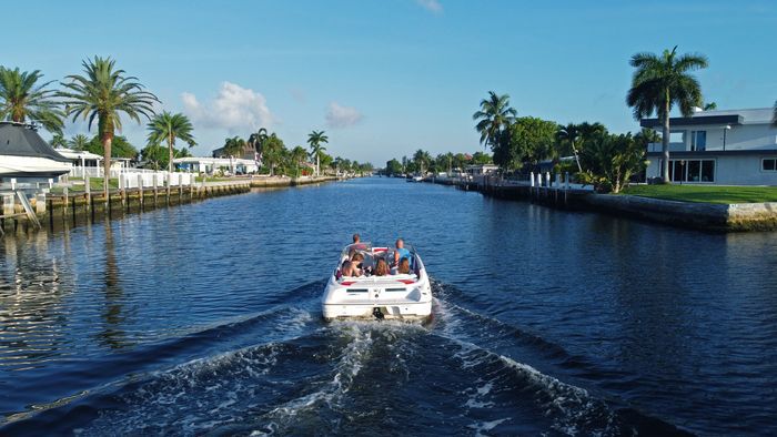 Speed boat with passengers in water