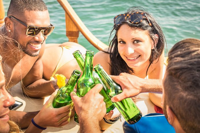 People enjoying drinks on boat